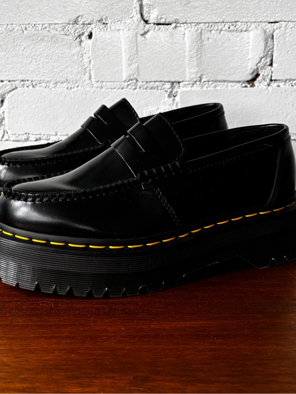 Dr. Martens Black Platform Penny Loafers with Yellow Stitching